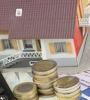 maison avec pièces et calculatrice